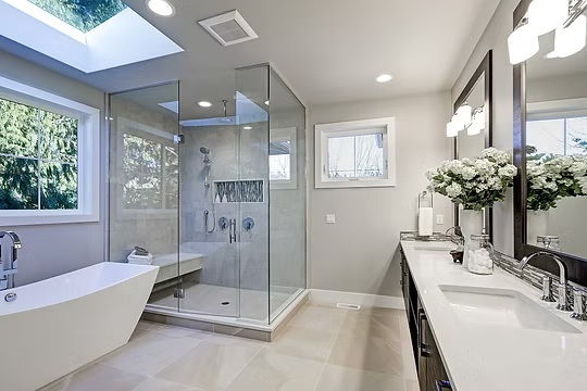 Spacious bathroom with glass-enclosed shower, freestanding tub, and double vanity